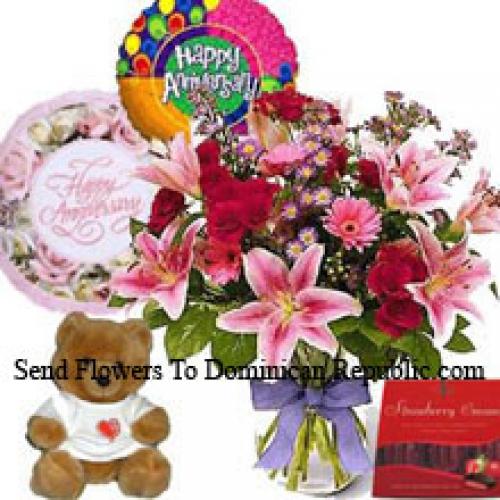 Fleurs assorties avec mignon ours en peluche et chocolats importés